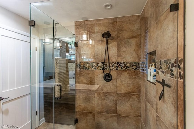 bathroom with a shower with shower door