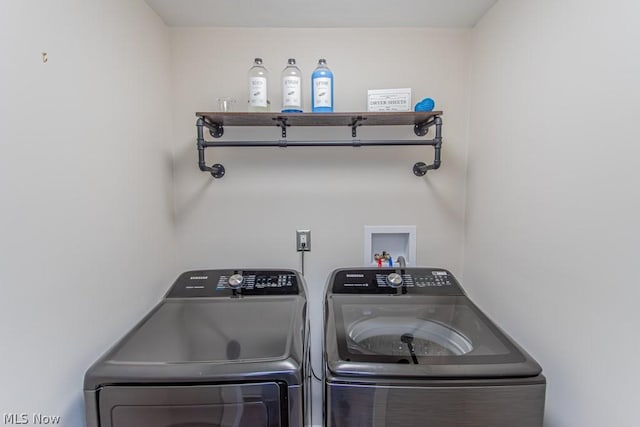 washroom featuring independent washer and dryer