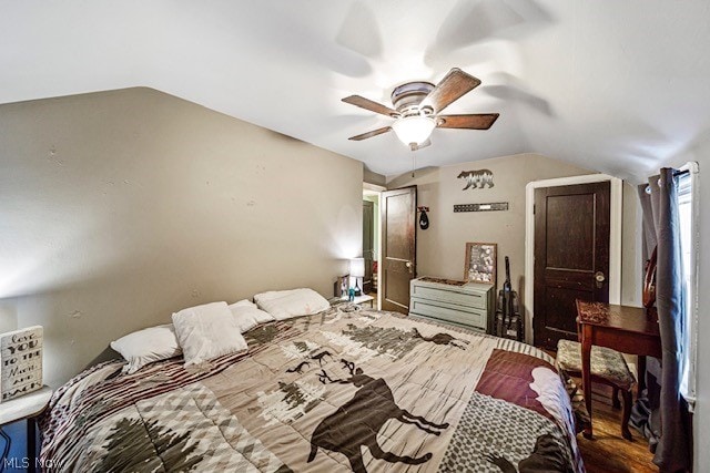 bedroom featuring ceiling fan, vaulted ceiling, and hardwood / wood-style floors