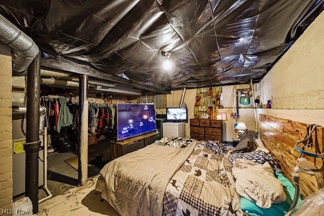 bedroom with a closet and concrete flooring