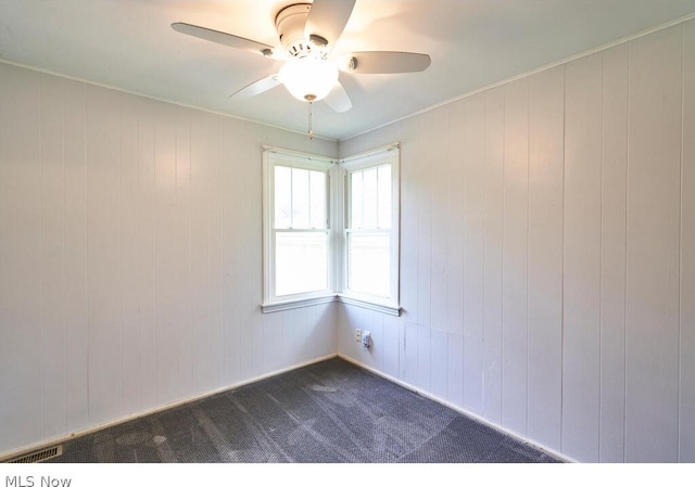 carpeted empty room with ceiling fan