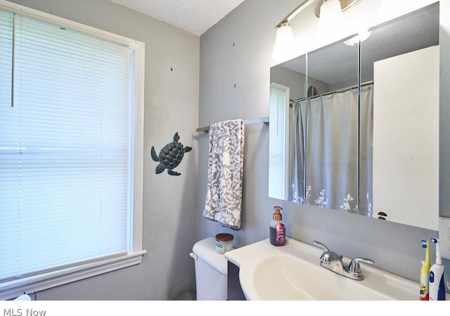 bathroom with sink and toilet