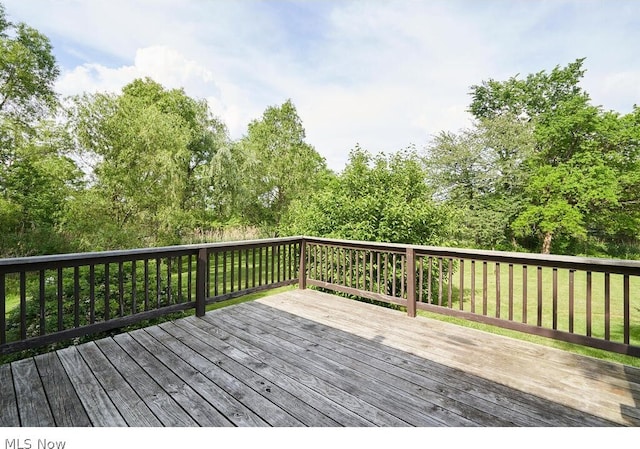 wooden deck with a yard