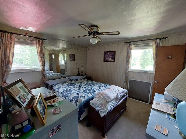 bedroom with ceiling fan and carpet floors