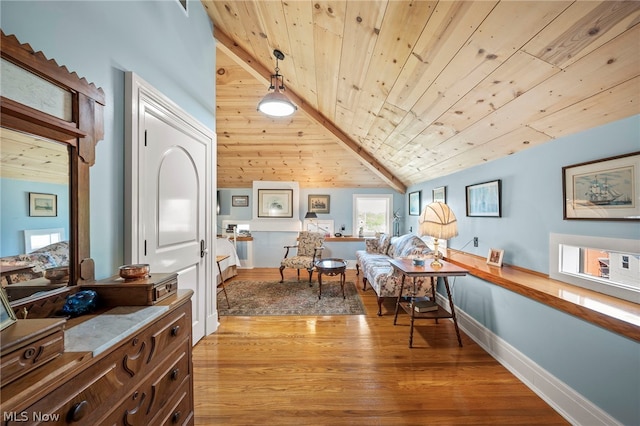 home office with lofted ceiling, wood ceiling, and light hardwood / wood-style floors