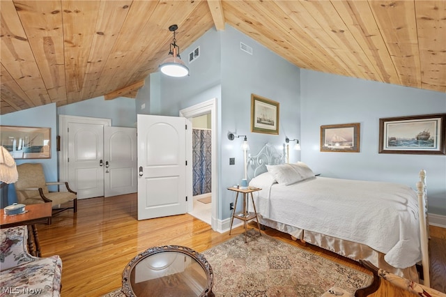 bedroom with lofted ceiling, hardwood / wood-style floors, and wood ceiling