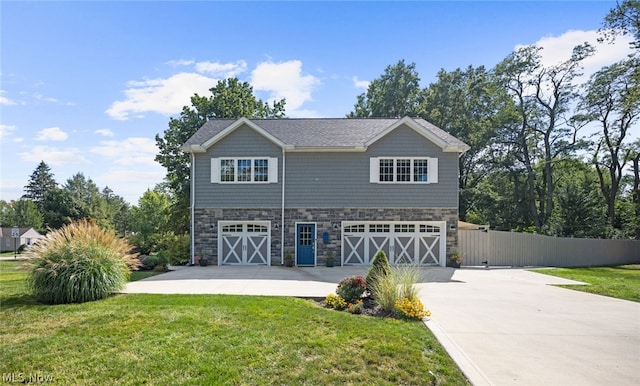 view of front facade with a front yard and a garage