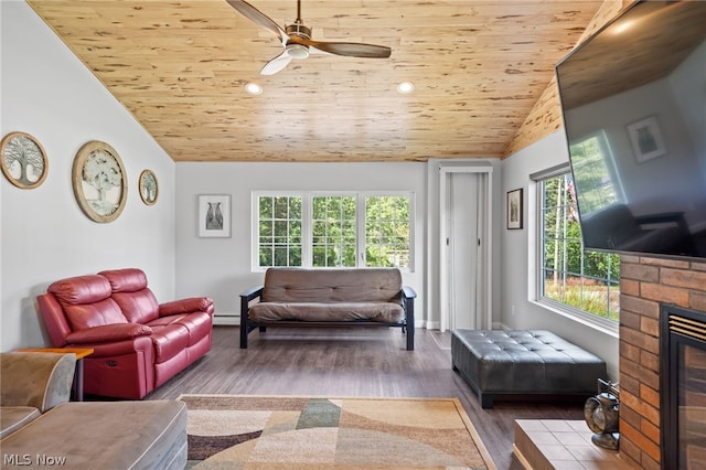 living room with hardwood / wood-style flooring, ceiling fan, wood ceiling, and vaulted ceiling