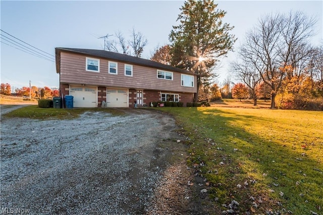 view of front facade featuring a garage and a front lawn