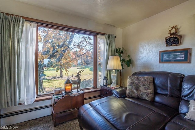 sitting room with carpet flooring and a baseboard radiator