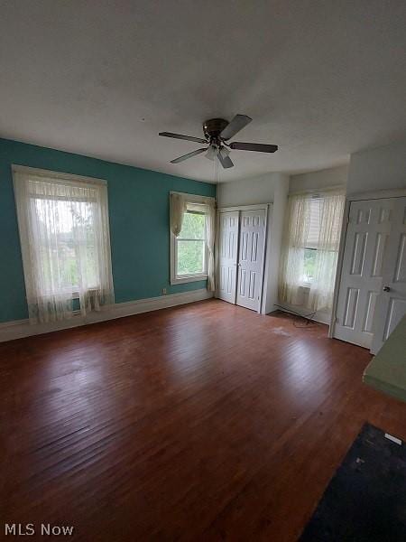 unfurnished bedroom with hardwood / wood-style floors and ceiling fan