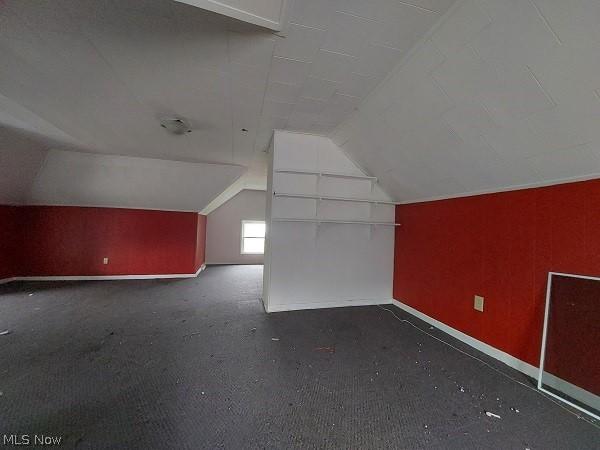 bonus room featuring lofted ceiling