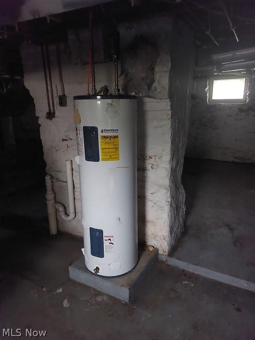 utility room featuring water heater