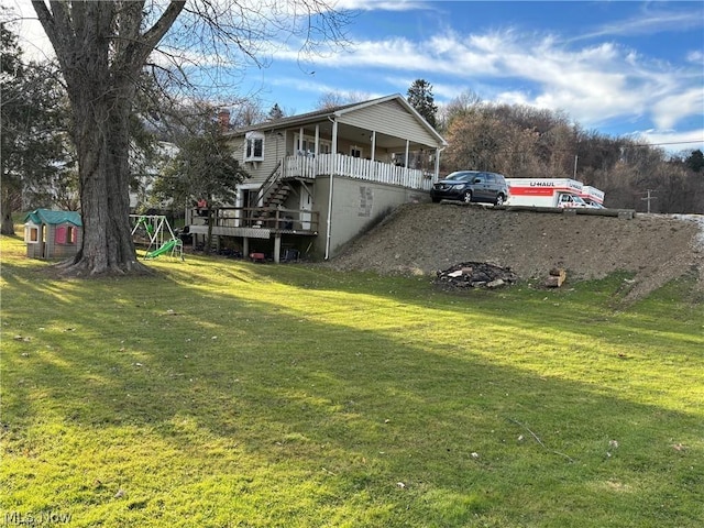 view of yard featuring covered porch