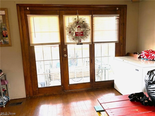 doorway to outside featuring hardwood / wood-style flooring