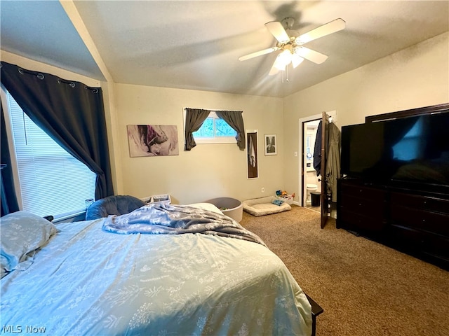 bedroom featuring ceiling fan, carpet flooring, and lofted ceiling