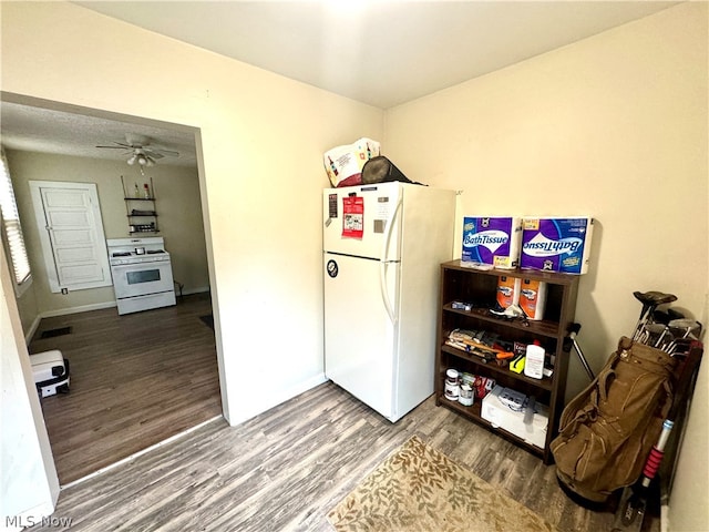 kitchen with ceiling fan, hardwood / wood-style floors, and white appliances