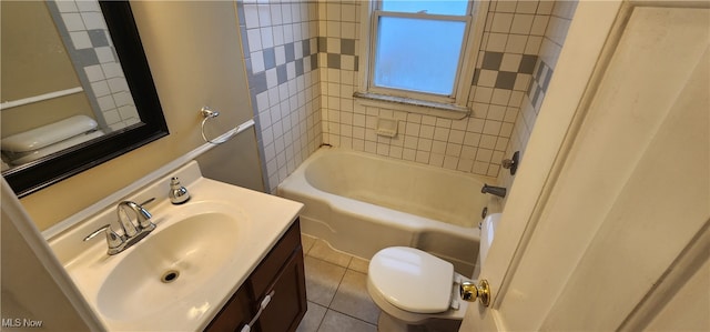 full bathroom featuring toilet, vanity, tile patterned floors, and tiled shower / bath