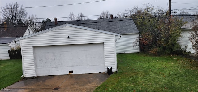 garage featuring a yard