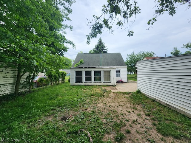 back of house with a patio area