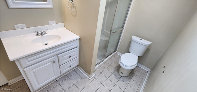 bathroom featuring vanity, toilet, tile patterned floors, and a shower with door