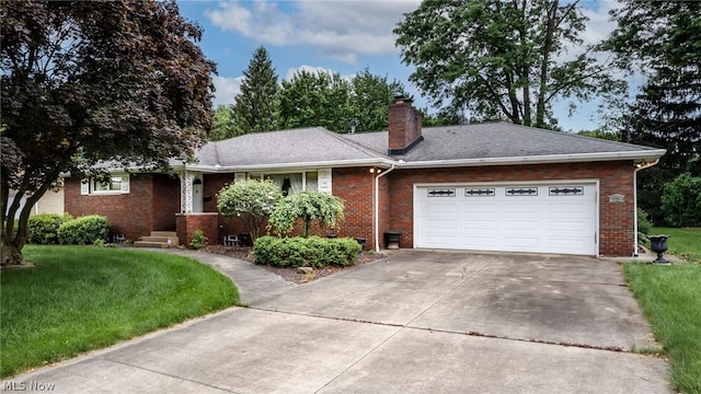 ranch-style home with a garage and a front yard