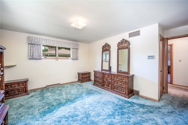 bedroom featuring baseboard heating and carpet floors