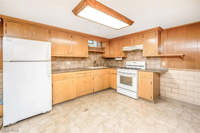 kitchen featuring white appliances and sink