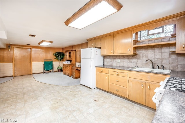 kitchen featuring white appliances and sink