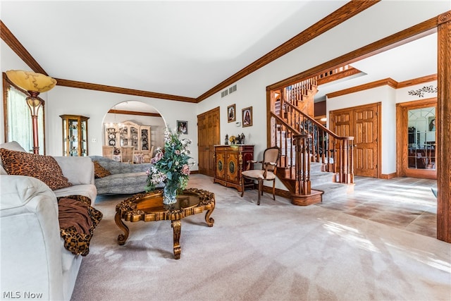 carpeted living room featuring crown molding