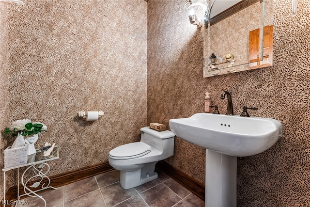 bathroom with tile flooring and toilet