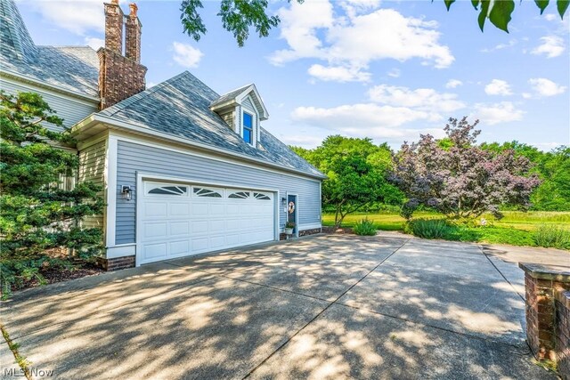 view of property exterior with a garage