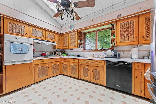 kitchen with ceiling fan, dishwasher, white oven, and light tile floors