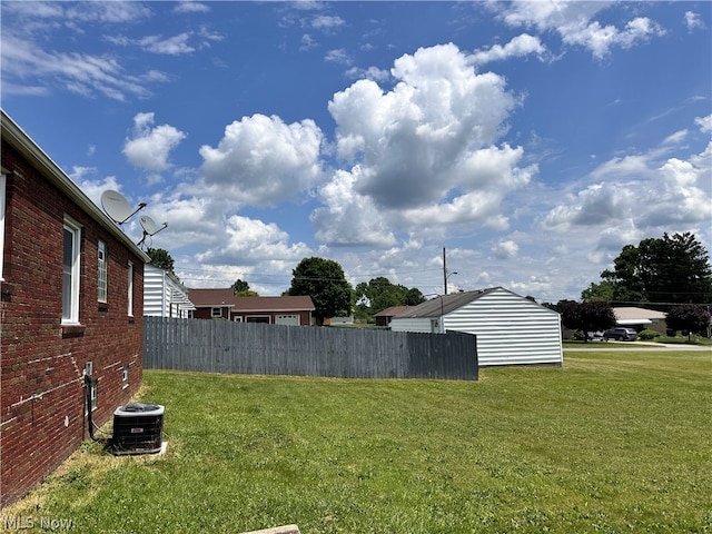 view of yard with central AC unit