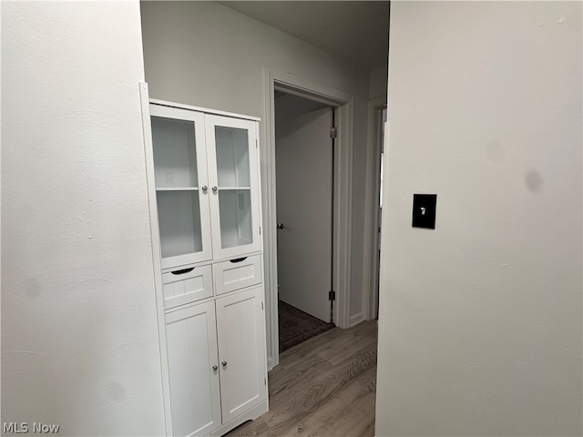 corridor featuring light hardwood / wood-style floors