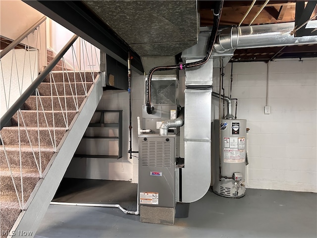 utility room featuring water heater