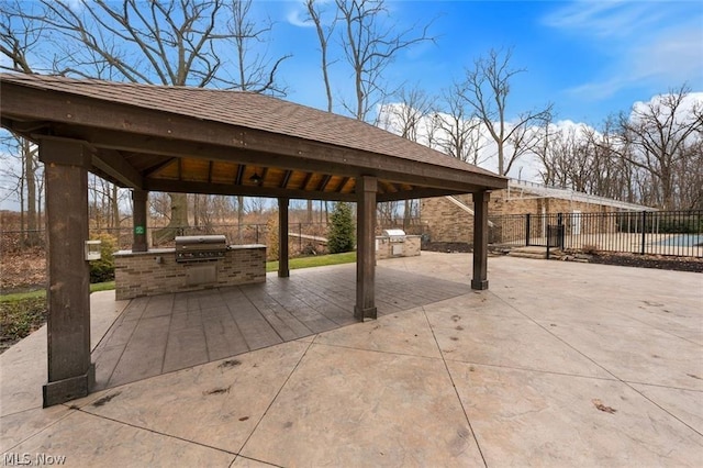 view of patio with a gazebo, a grill, and exterior kitchen