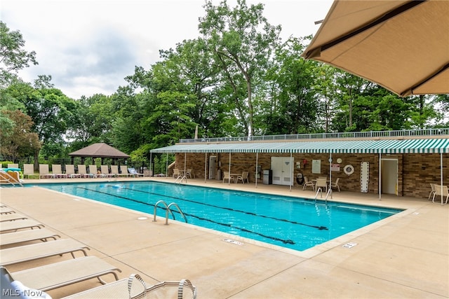 view of swimming pool featuring a patio