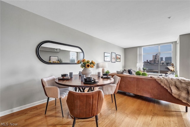 dining space featuring light hardwood / wood-style flooring