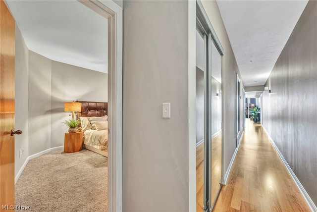 hallway with light wood-type flooring