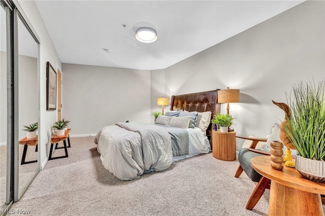 bedroom featuring light carpet