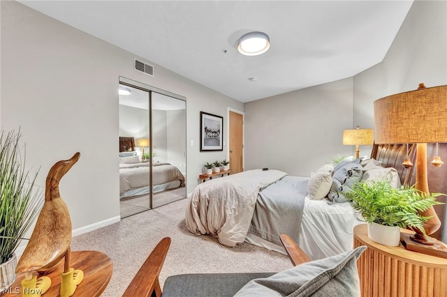 bedroom with carpet and a closet