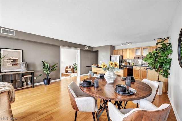 dining room featuring light hardwood / wood-style floors