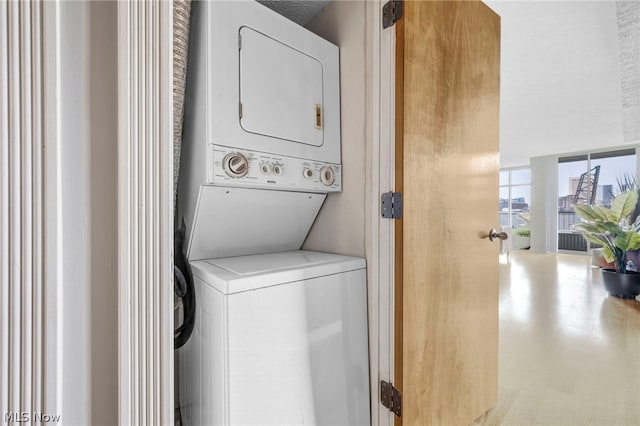 laundry room featuring stacked washer and dryer