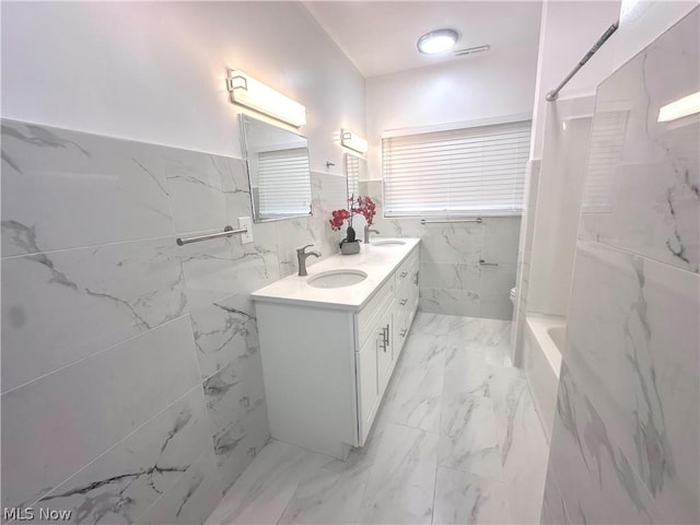 bathroom featuring vanity and shower / bath combo with shower curtain