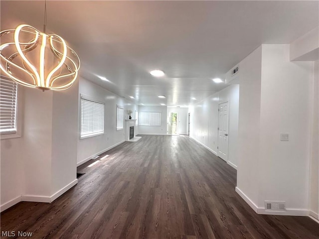 unfurnished living room featuring dark wood-type flooring