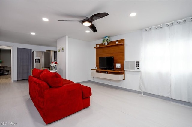 living room with visible vents, a ceiling fan, and recessed lighting