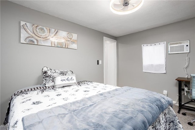 carpeted bedroom featuring a wall mounted AC