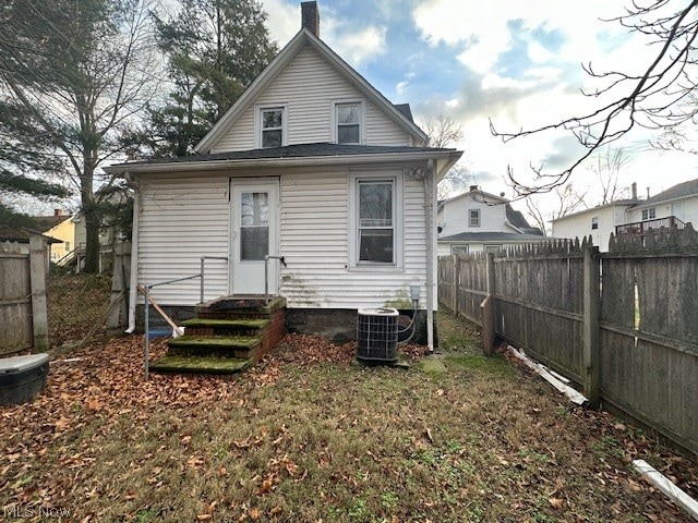 back of property with central air condition unit