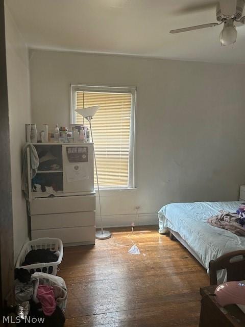 bedroom featuring hardwood / wood-style flooring and ceiling fan